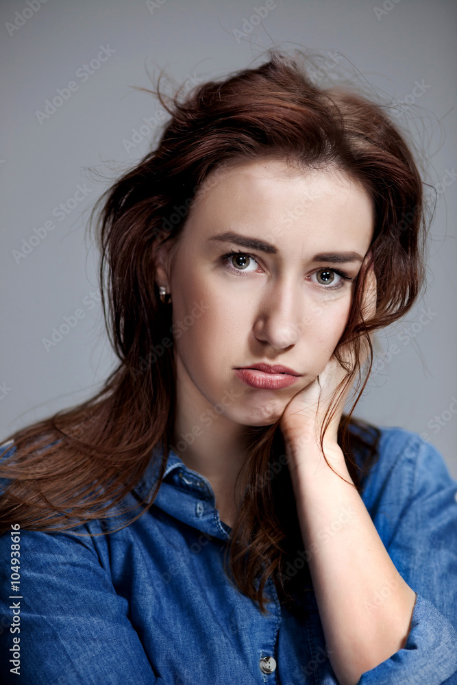 The portrait of a beautiful sad girl closeup The portrait of a beautiful sad girl closeup