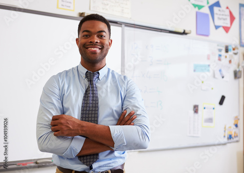 Portrait of confident African American male teacher in class photo