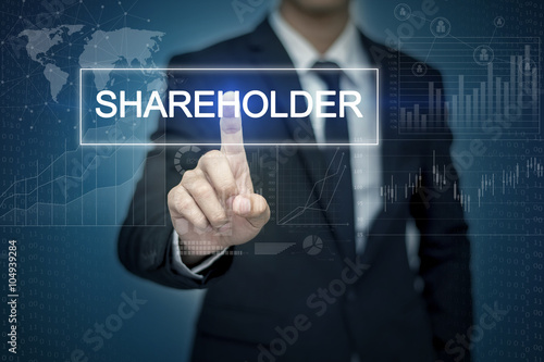 Photography Businessman hand touching SHAREHOLDER  button on virtual screen