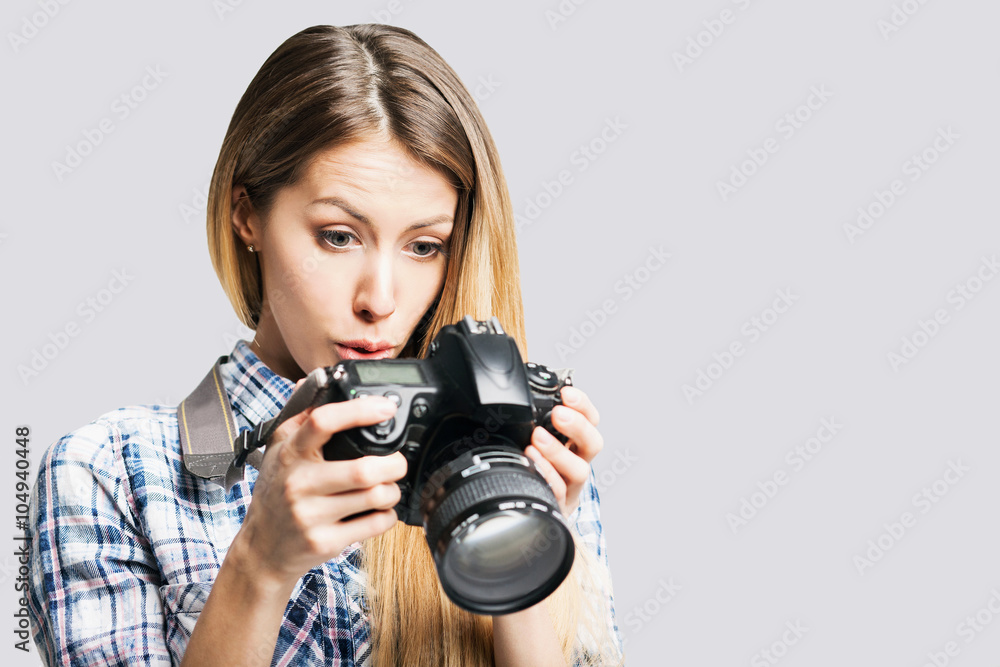 Woman photographer takes images with dslr camera Woman photographer takes images with dslr camera