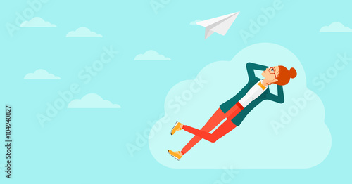 Business woman relaxing on cloud.
