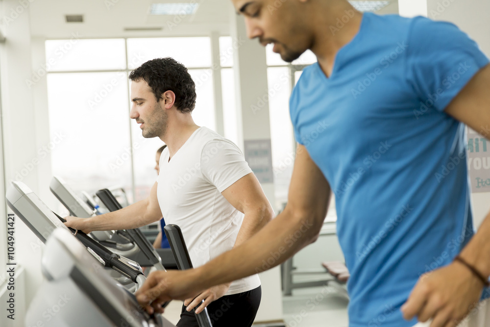 Young multiracial men in the gym Young multiracial men in the gym