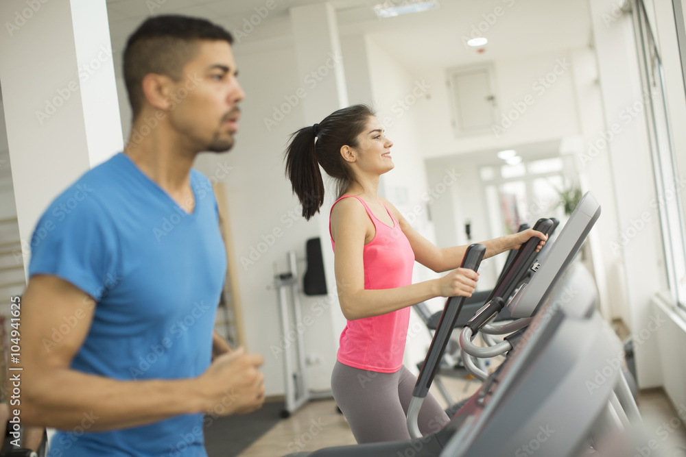 Young people training in the gym Young people training in the gym