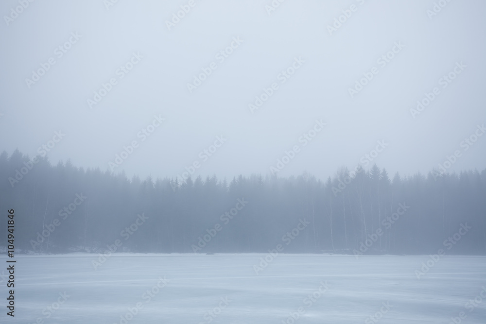 Thick fog at frozen lake landscape Thick fog at frozen lake landscape