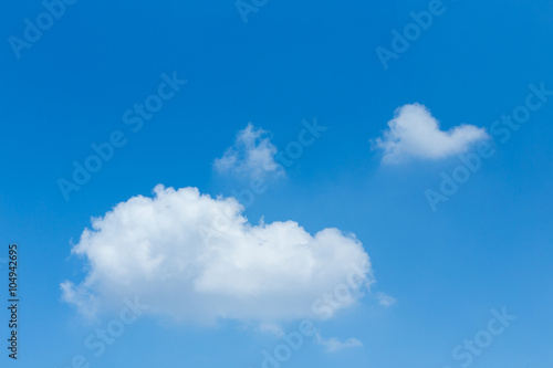 single cloud on clear blue sky background