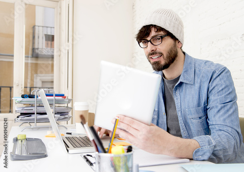 young hispanic attractive hipster businessman working at modern home office