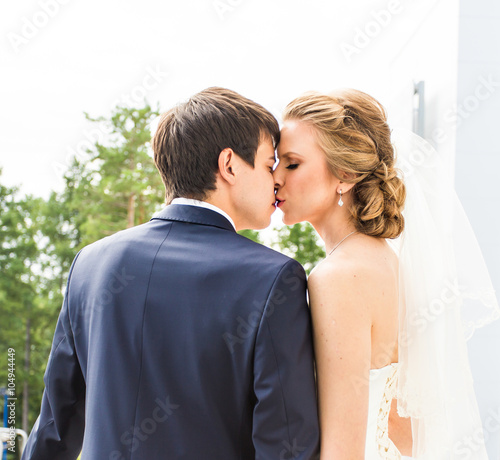 Wedding, Beautiful Romantic Bride and Groom Kissing 