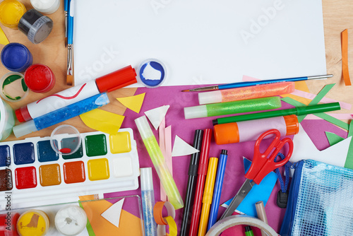 artwork workplace with creative accessories, art tools for painting and drawing