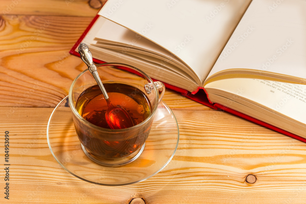 Cup of tea and books onwooden background Cup of tea and books onwooden background