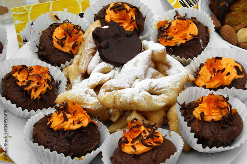 Chocolate cupcakes with orange cream photo