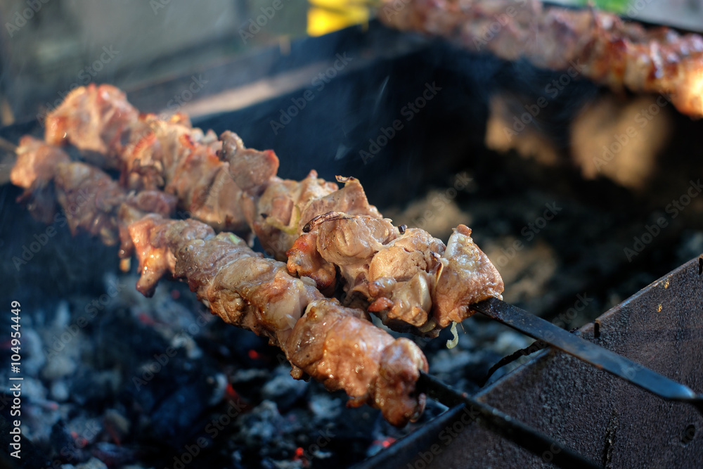 Grilling marinated shashlik on a grill Grilling marinated shashlik on a grill