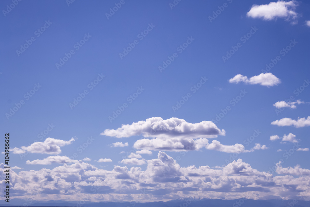 Fluffy white clouds and clear blue sky Fluffy white clouds and clear blue sky