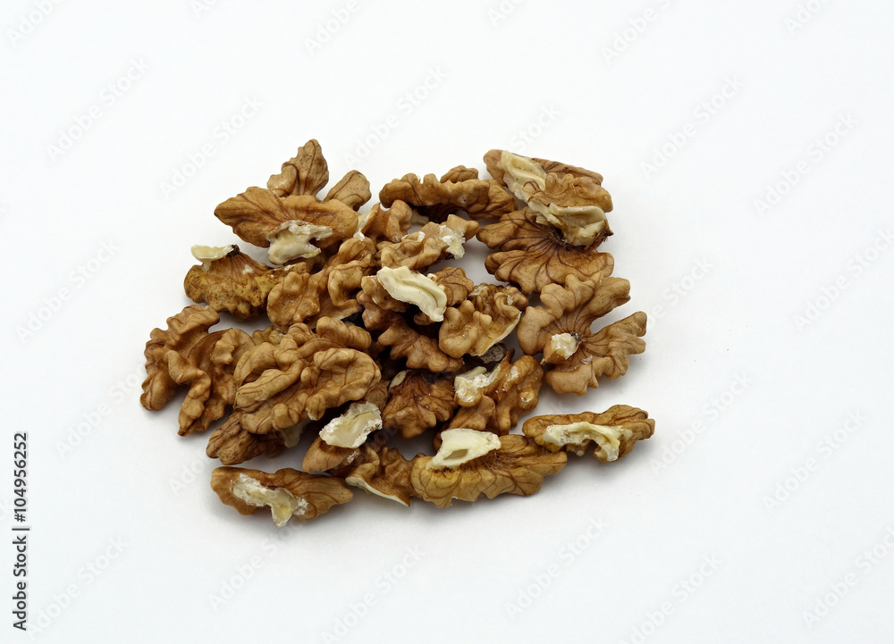 shelled walnuts on a white background