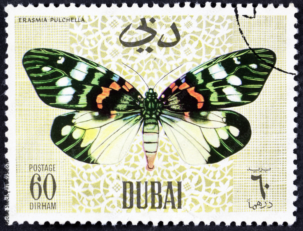 Naklejka premium DUBAI - CIRCA 1968: A stamp printed by Dubai, shows Butterflyv, Circa 1968