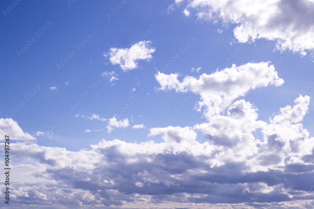 Fototapeta premium Fluffy white clouds and clear blue sky 