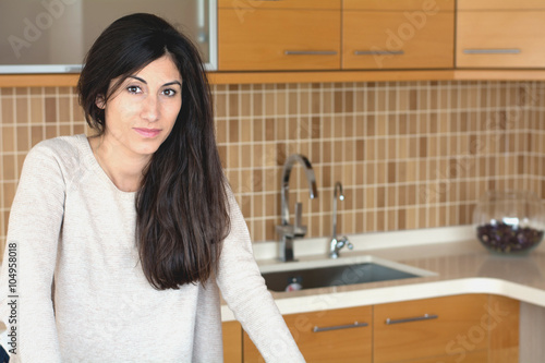 Young beautiful woman in the kitchen