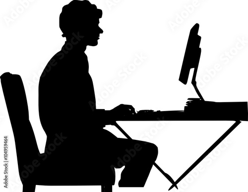 man behind a computer desk 