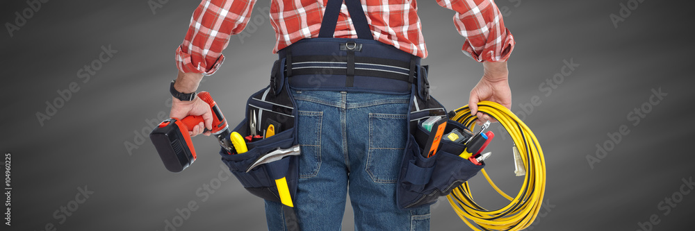 Electrician with drill and cable. Electrician with drill and cable.