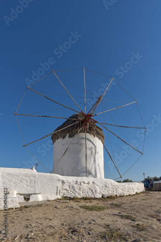 White windmill and medieval wall on the island of Mykonos, Cyclades, Greece