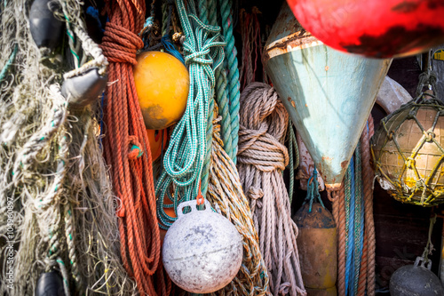 Nautical background. Closeup of old colorful mooring ropes , Old
