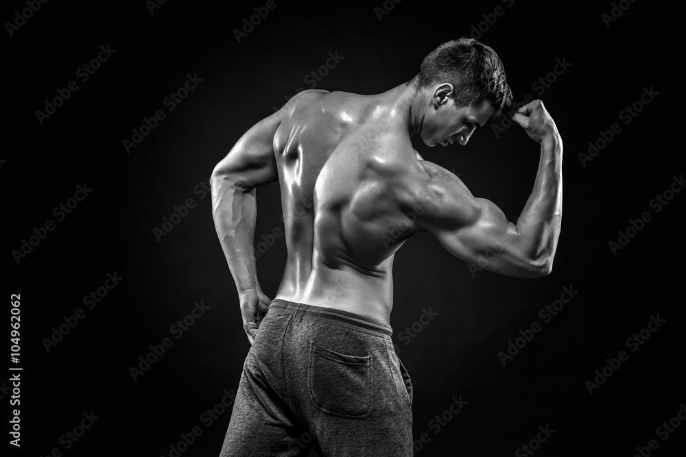 Healthy muscular man on showing perfect biceps, triceps, rear vi
