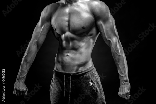 Close-up of man model torso posing showing perfect body