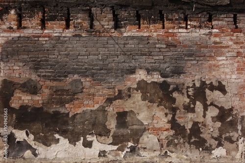 Burned Plaster and Brick Wall