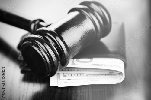 Bild auf Leinwand Gavel and money in wallet on wooden background. Retro stylization