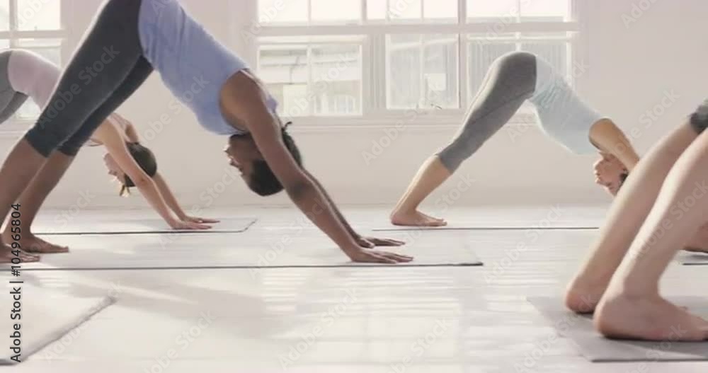 Yoga class multi racial group of women exercising fitness healthy lifestyle