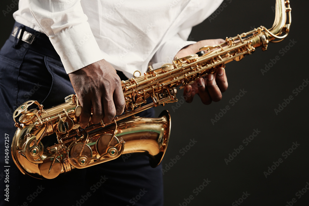 Obraz premium African American jazz musician playing the saxophone, closeup