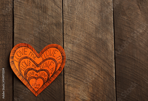 Orange Valentine with inscription on wooden background