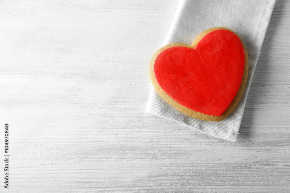 Valentine heart cookie on wooden background