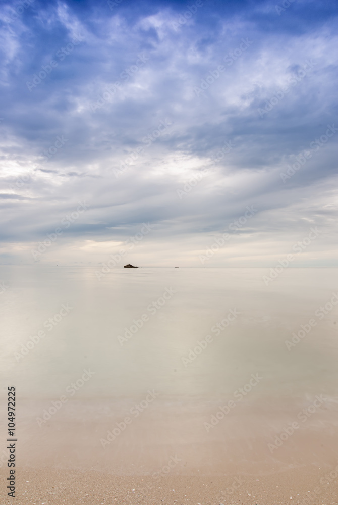 Long exposure with blurred motion on wave at the beach. Soft foc Long exposure with blurred motion on wave at the beach. Soft foc