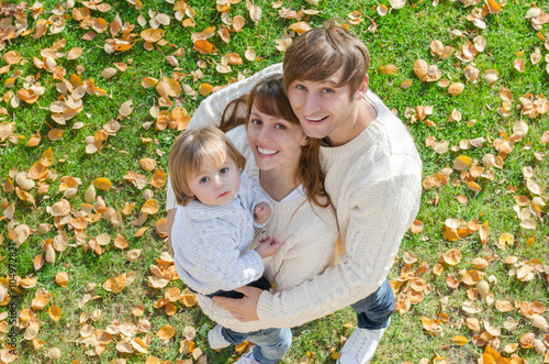 portrait of a happy family smiling in autumn a top view © malush