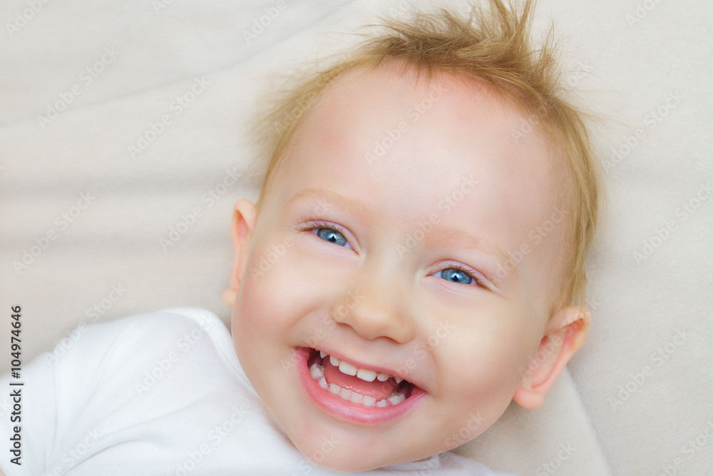 The red-haired and blue-eyed boy laughing The red-haired and blue-eyed boy laughing