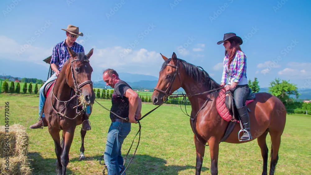 Young woman getting off her horse Young woman getting off her horse