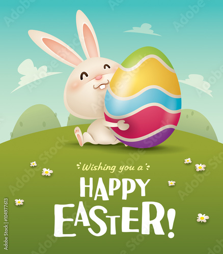 Happy Easter! Easter bunny and egg in field. 