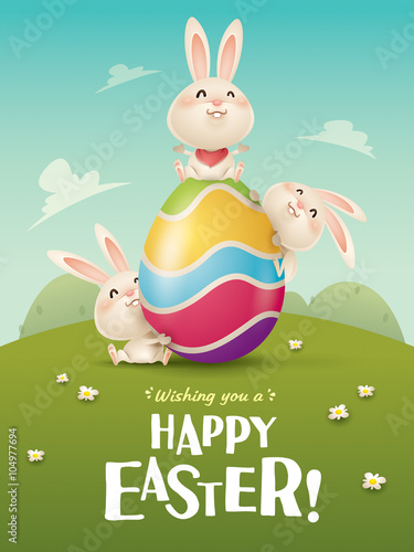 Happy Easter! Easter bunnies and egg in field. 