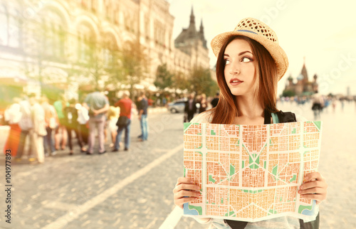 Traveler with map on stret,...