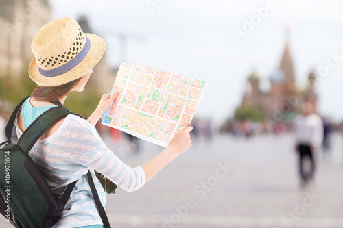 Traveler with map on city b...