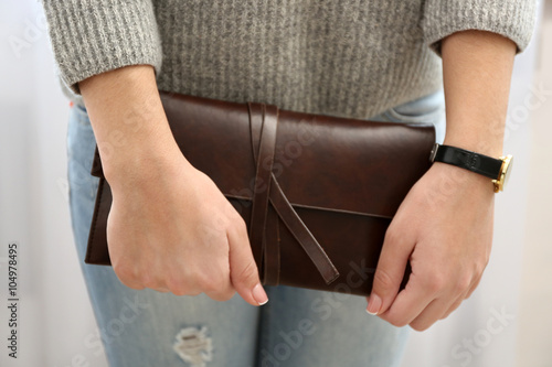 Girl with brown wallet