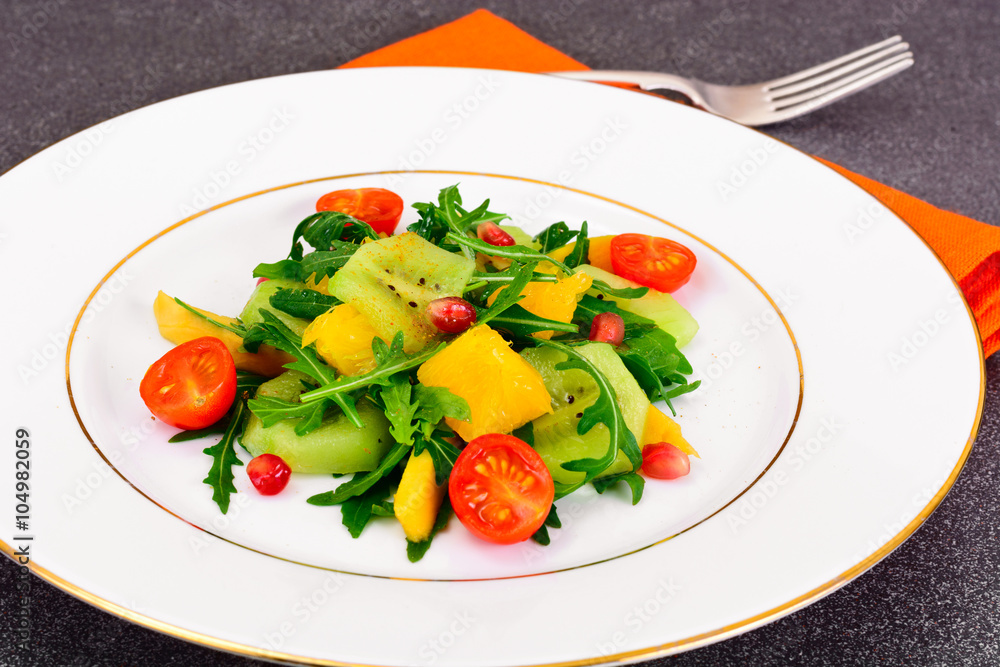 Fresh mango, arugula, kiwi, orange and pomegranate. Fresh mango, arugula, kiwi, orange and pomegranate.