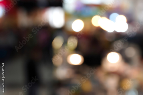 blurred image with customers in department store for background usage .