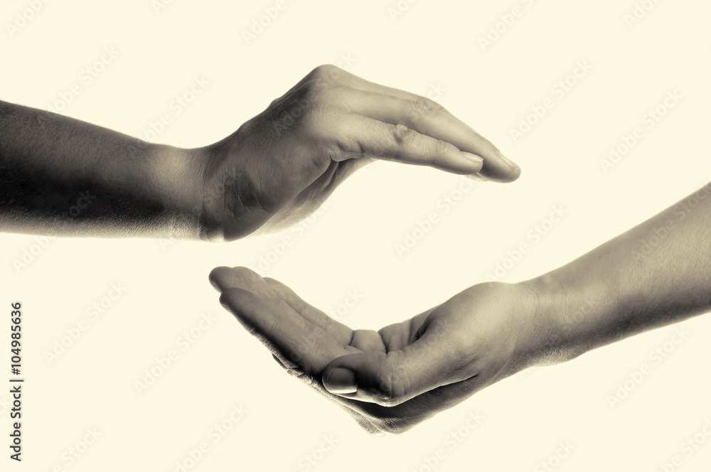 isolated toned image of two hands facing each other as a symbol of protection and insurance isolated toned image of two hands facing each other as a symbol of protection and insurance