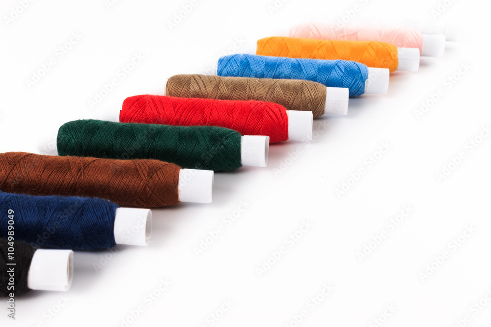 Colorful sewing bobbin thread isolated on white. Colorful sewing bobbin thread isolated on white.