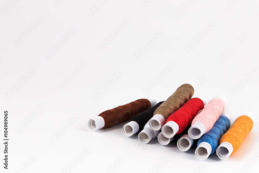 Colorful sewing bobbin thread isolated on white. Colorful sewing bobbin thread isolated on white.