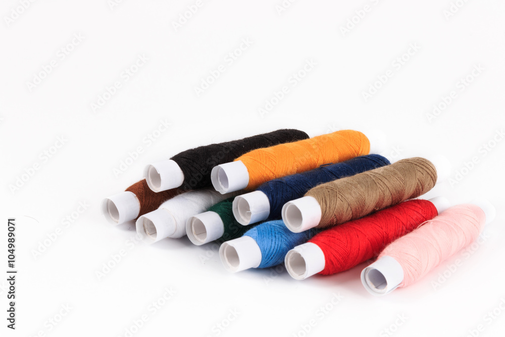 Colorful sewing bobbin thread isolated on white. Colorful sewing bobbin thread isolated on white.