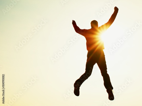 Fotografia Flying man. Young man falling down on sky background.