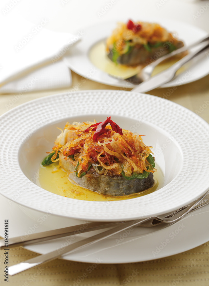 Fresh tuna fish served with fried vegetables. Fresh tuna fish served with fried vegetables.