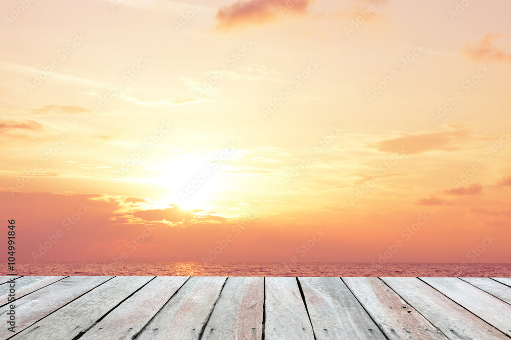 Wooden floor.Background sunset over the sea
